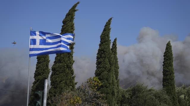 Greece wildfire contained as winds prompt evacuations