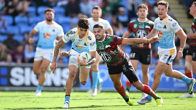 Mitchell stars on return as Souths hold out Titans