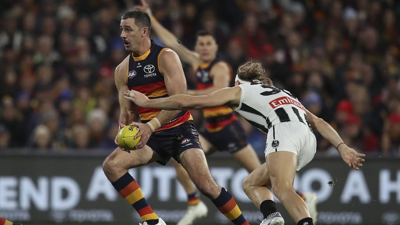 Adelaide edge Collingwood in thriller to keep top spot