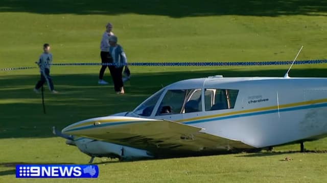 Light plane crash lands on suburban golf course