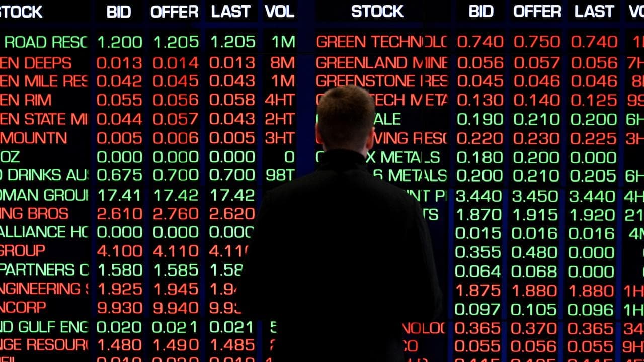 Australian shares drop while gold glitters to new high