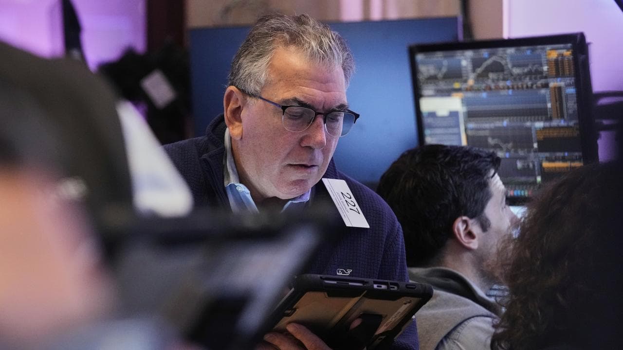 Wall St posts record-high closes after data releases