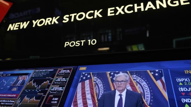 Wall Street lower as investors weigh Powell comments