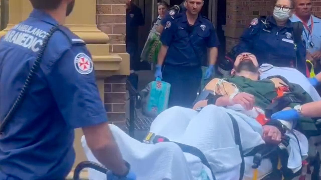 Bloodied murderer leaves in ambulance, not prison van