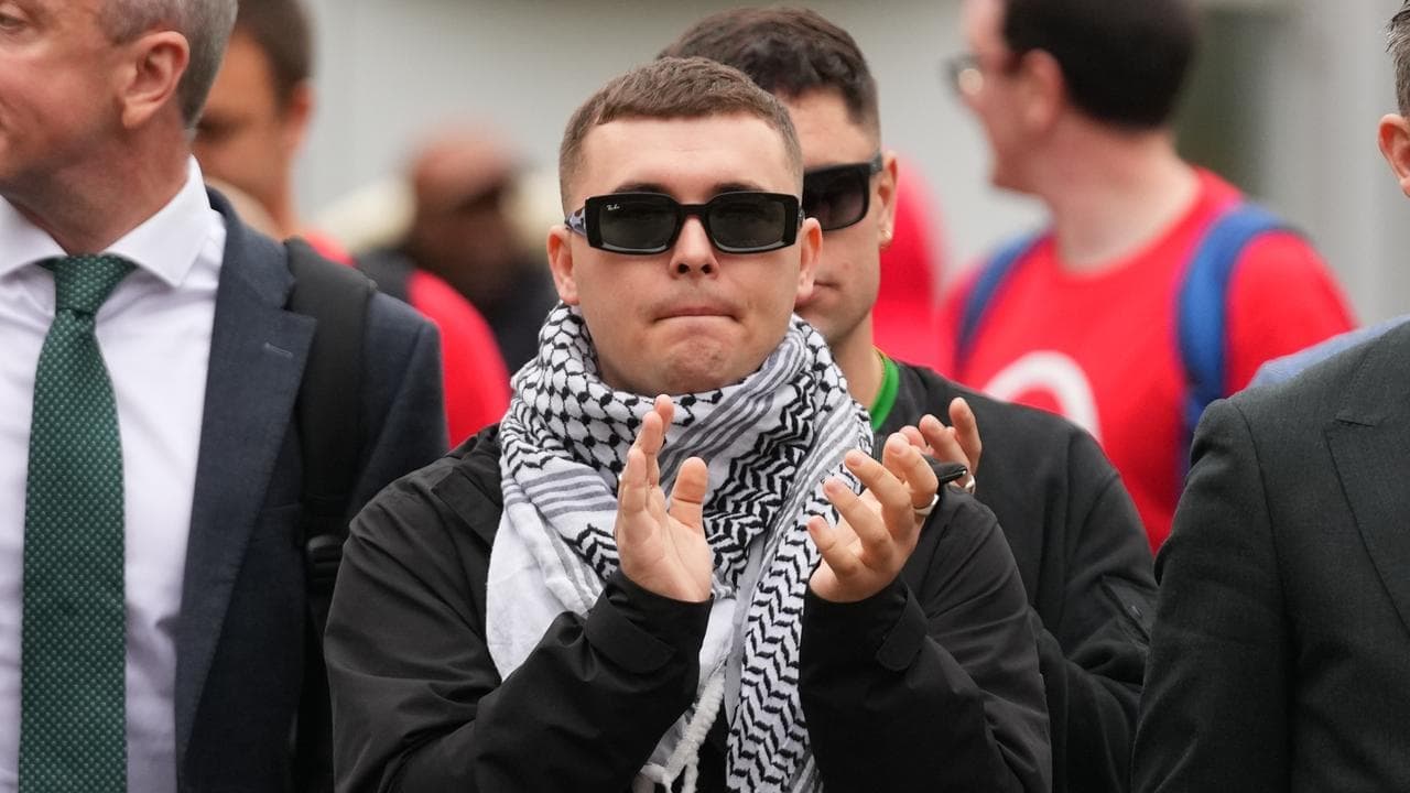 UK court tosses terror charge against Kneecap member