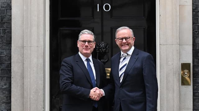 PM all smiles on subs pact after Downing Street chat