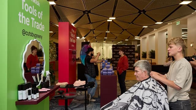 Social media ban trims budding young barber's following