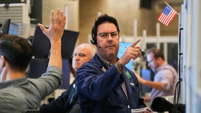 Wall Street ends down, US-China trade tensions remain