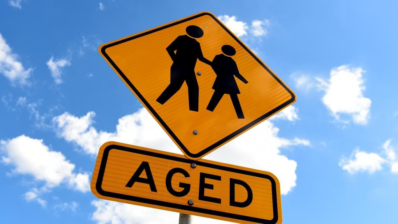 Aged care worker charged after 104-year-old robbed