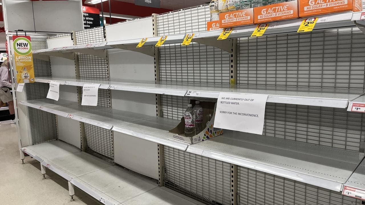 Residents stock up on supplies to ride out storm