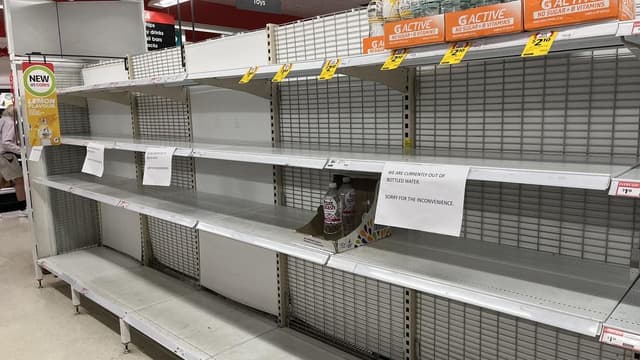 Residents stock up on supplies to ride out storm
