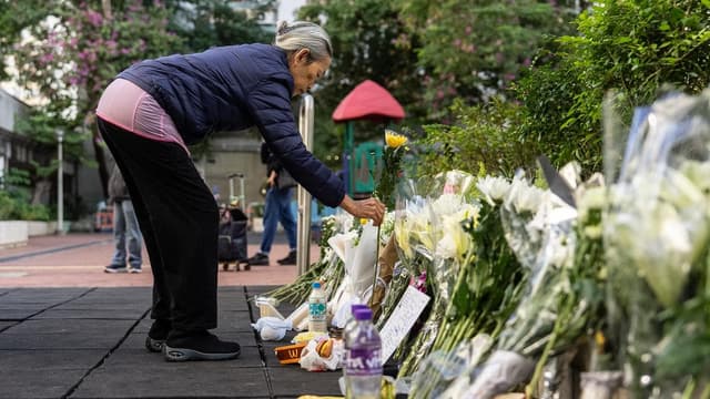 Hong Kong mourns victims of blaze that killed 128