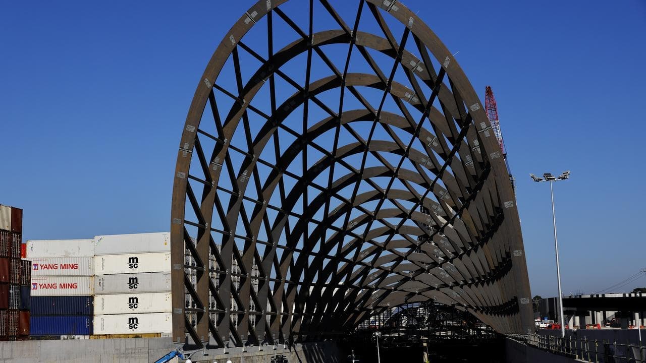 Problem-plagued toll road opens after decade of delays