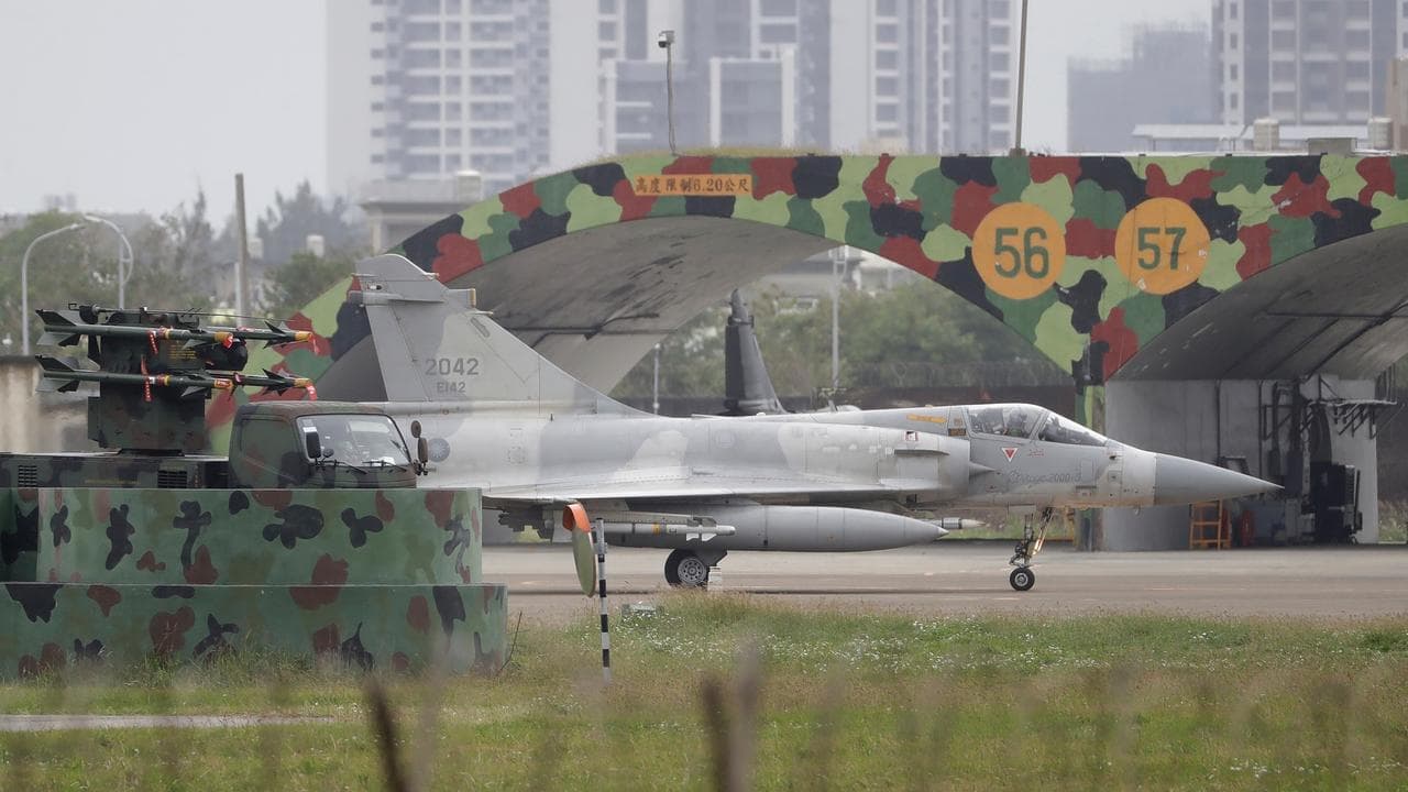 Taiwan stays on high alert as Chinese ships pull back