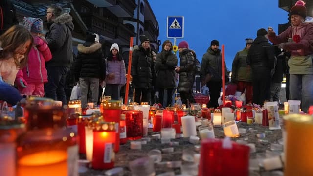 Stunned Swiss resort seeks solace after deadly bar fire