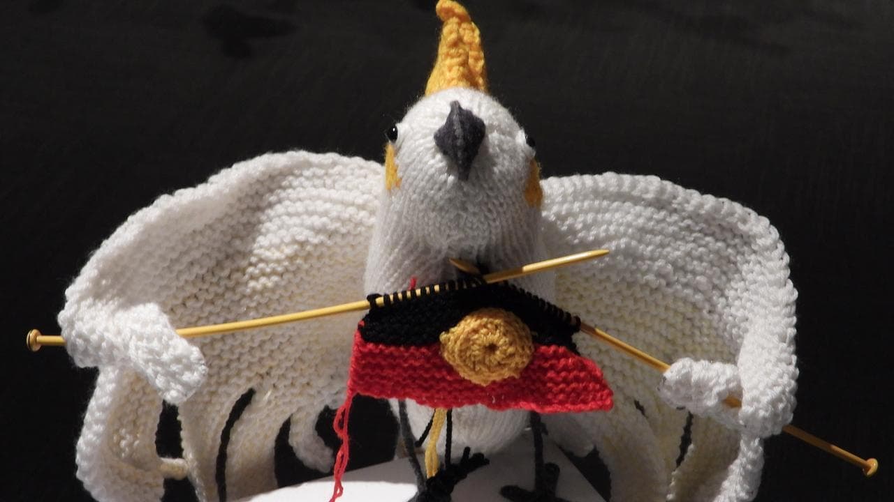 Birds of a feather knitted together by rural artist