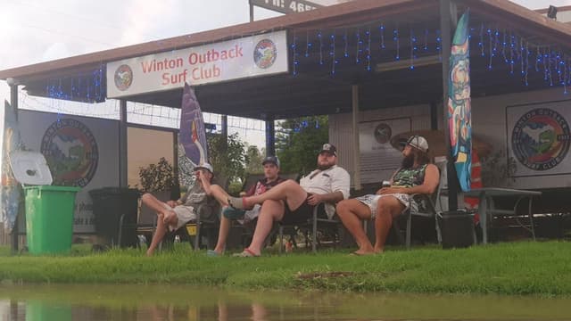 Slow and soggy: life goes on in isolated flood-hit town