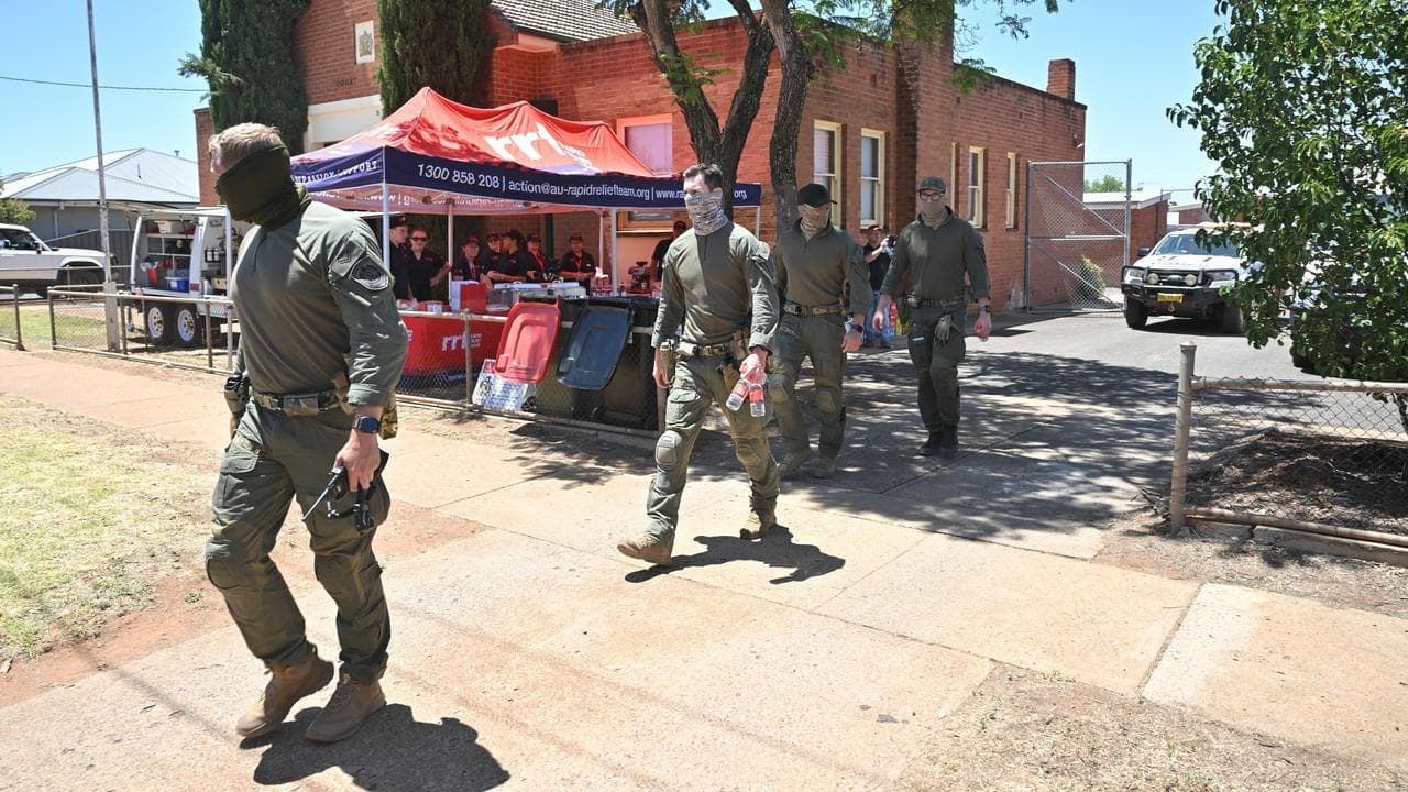 Search widens in manhunt for alleged triple murderer