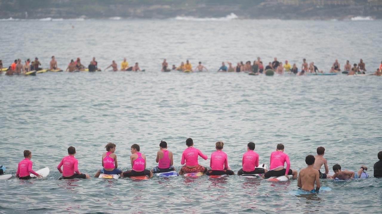 'Loved life': mass paddle-out for young shark victim