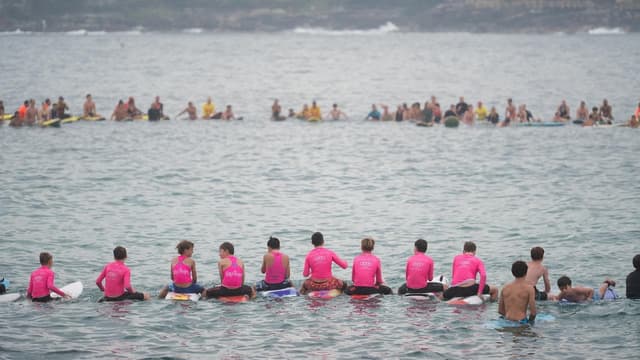 'Loved life': mass paddle-out for young shark victim
