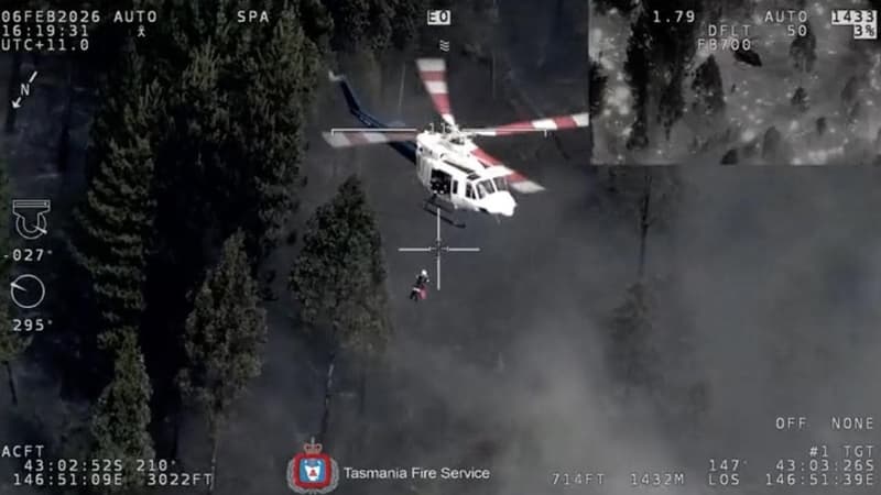 Woman winched to safety in dramatic bushfire rescue