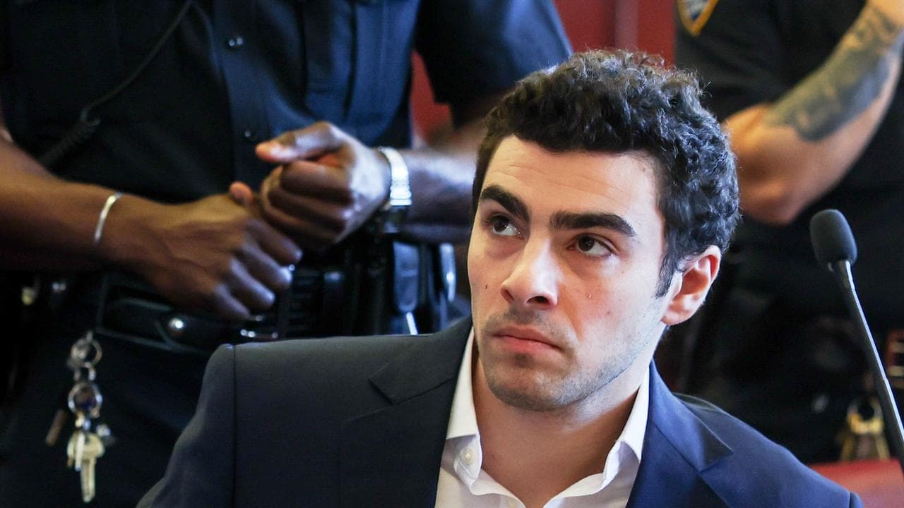 Mangione protests as US judge sets state trial for June