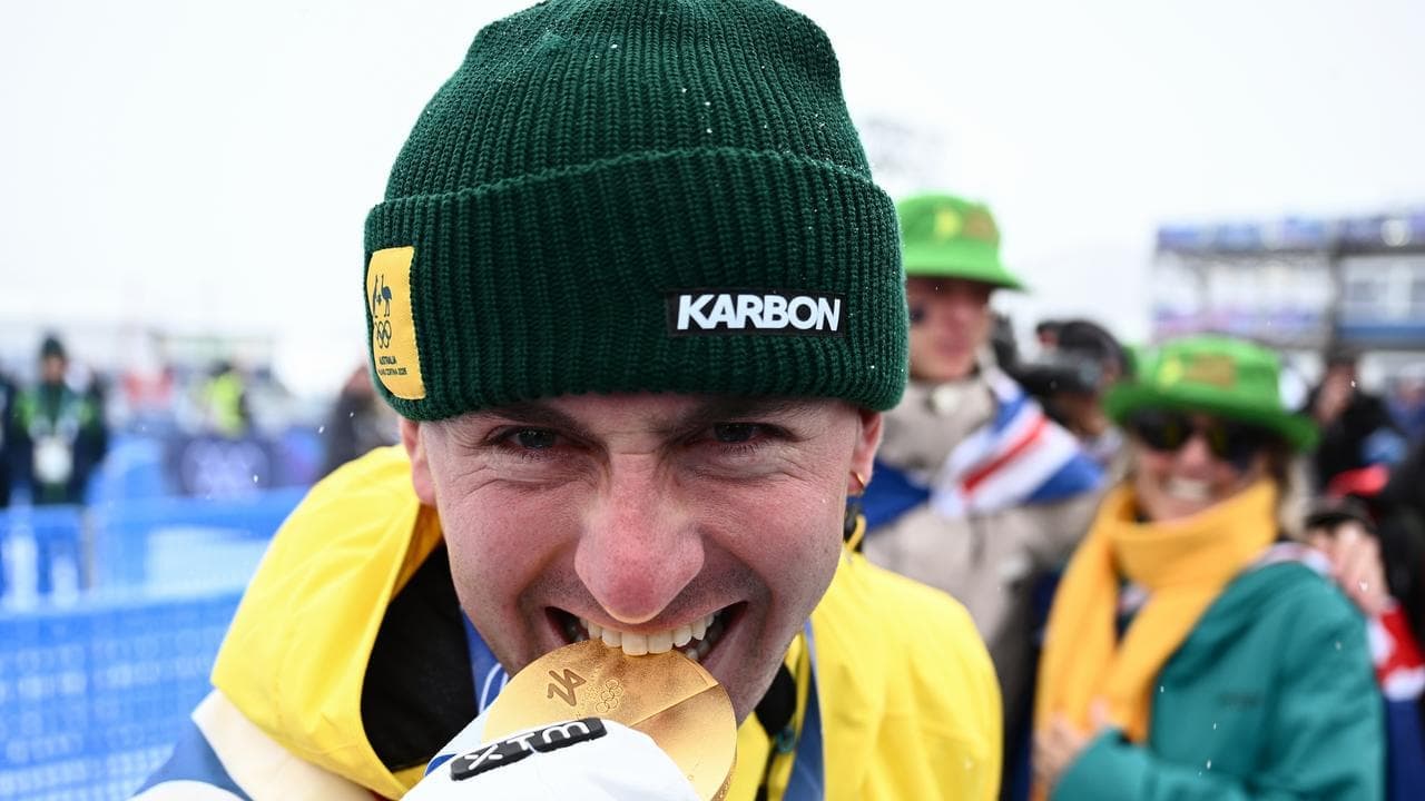 Hungry for gold: Woods chases another in dual moguls
