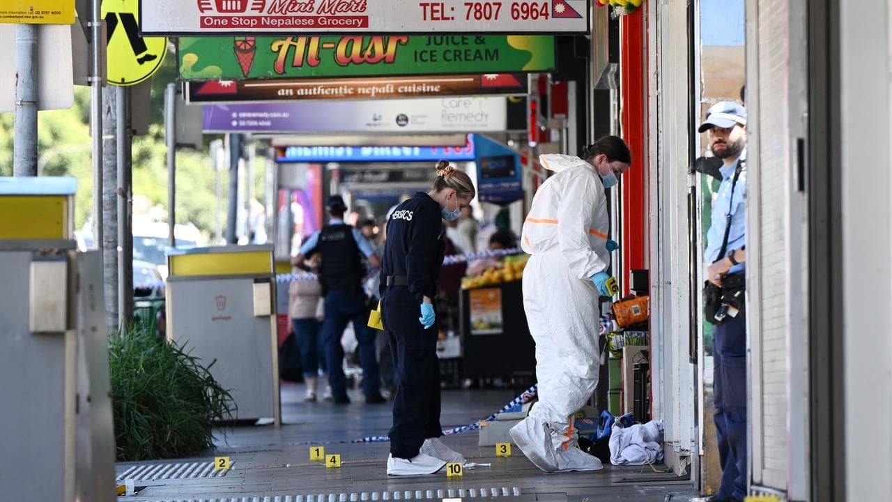 One dead in 'random' triple stabbing on high street