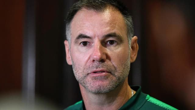 A man named Tracy helps Milicic solve a Chinese puzzle