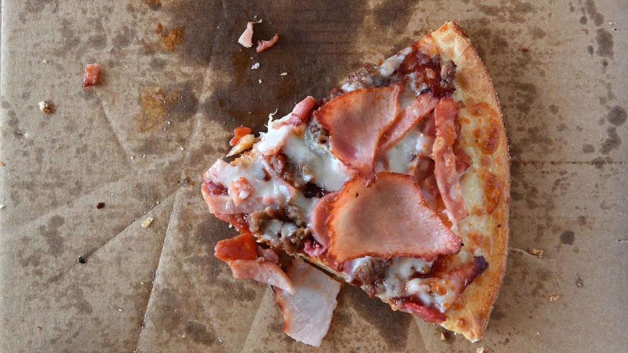 Investors take big slice out of Domino's despite profit