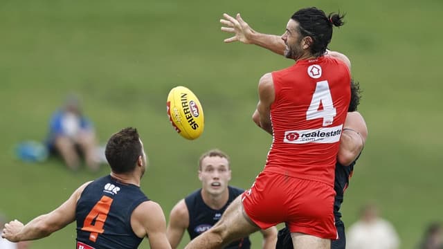 Grundy stars as Swans thrive amid Sydney wet