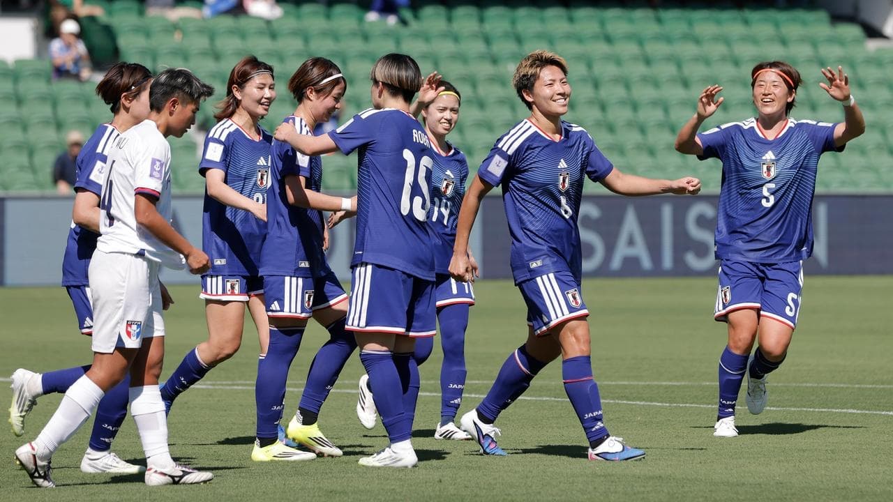 Favourites Japan overcome heat, plucky Taiwan in Cup