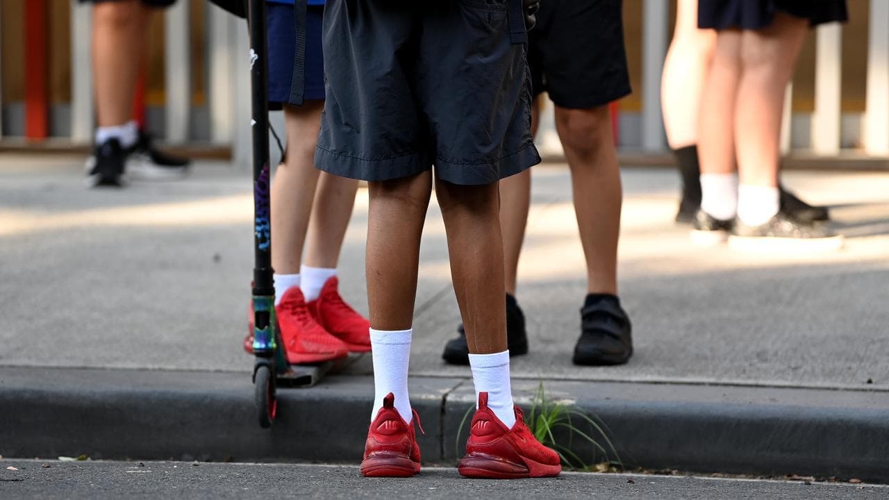 Four teachers charged with assaulting young students