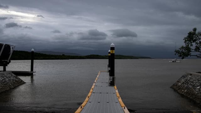 Cyclone on move as flood-weary region watches and waits