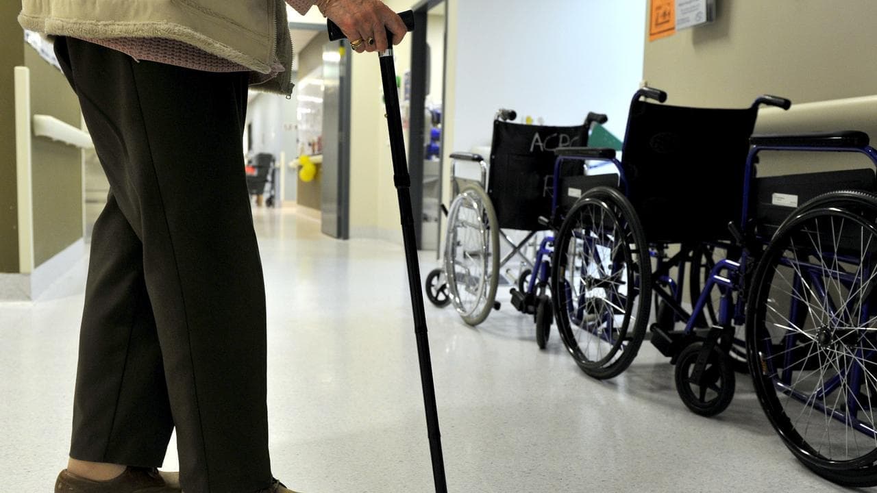Private health rebate cut to fund aged care shower fees