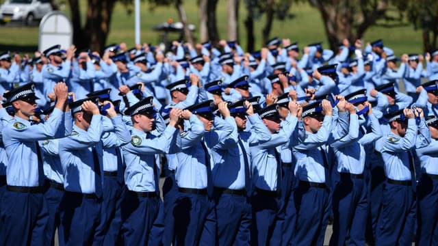 Police force under scrutiny swells ranks with recruits