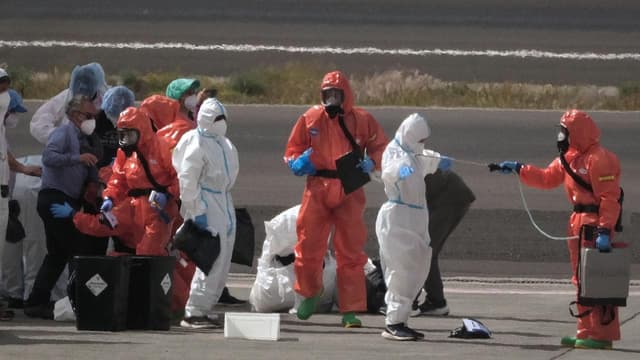 Two more test positive as ship evacuation nears end