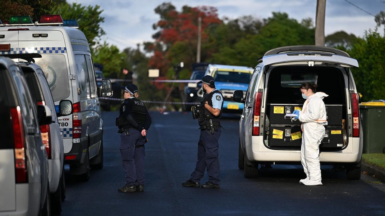 Man charged with triple murder of wife and children
