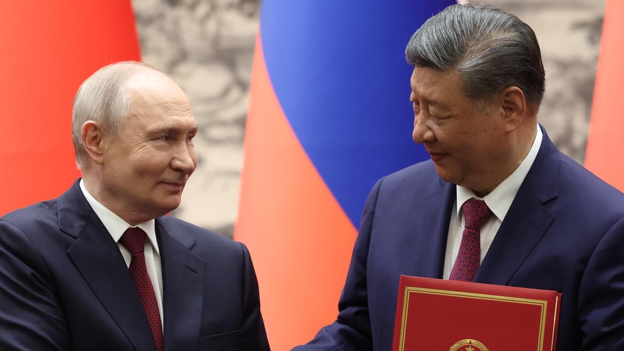 Putin and Xi hail ties and energy trade at China talks