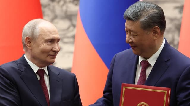 Putin and Xi hail ties and energy trade at China talks