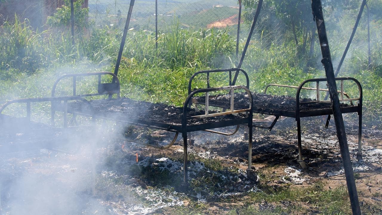 Protesters set fire to Ebola tents in dispute over body