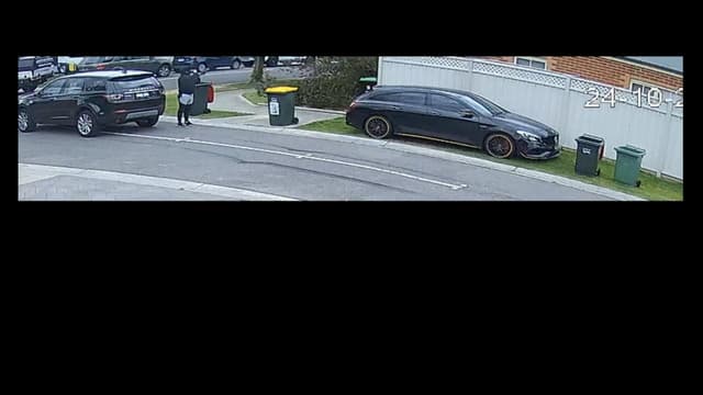 Footage shows masked gunman firing on suburban street