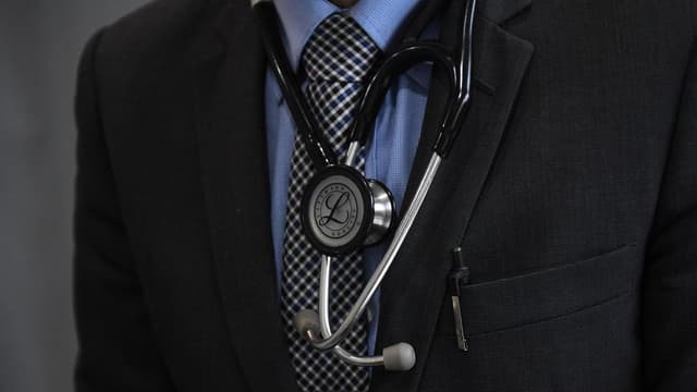 Pediatrician accused of molesting 10 kids faces court