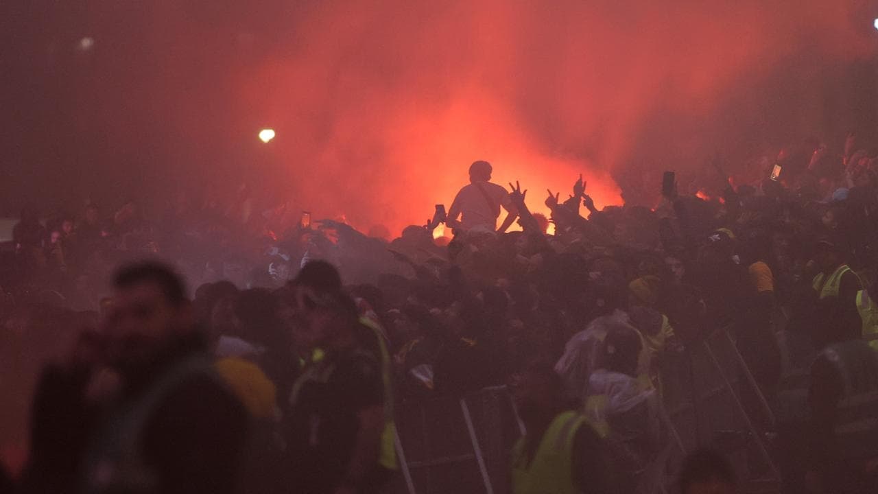 Socceroos fan suffers flare to face in World Cup chaos