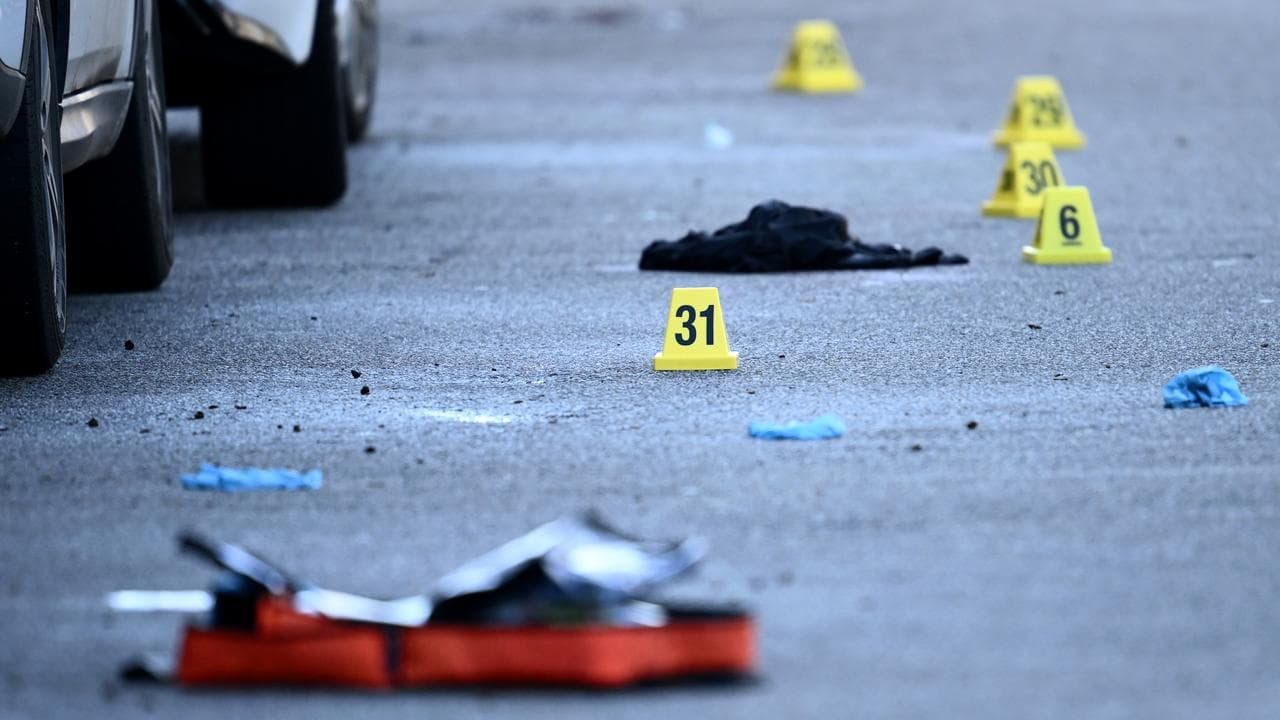 Innocent man almost mowed down after gangland shooting