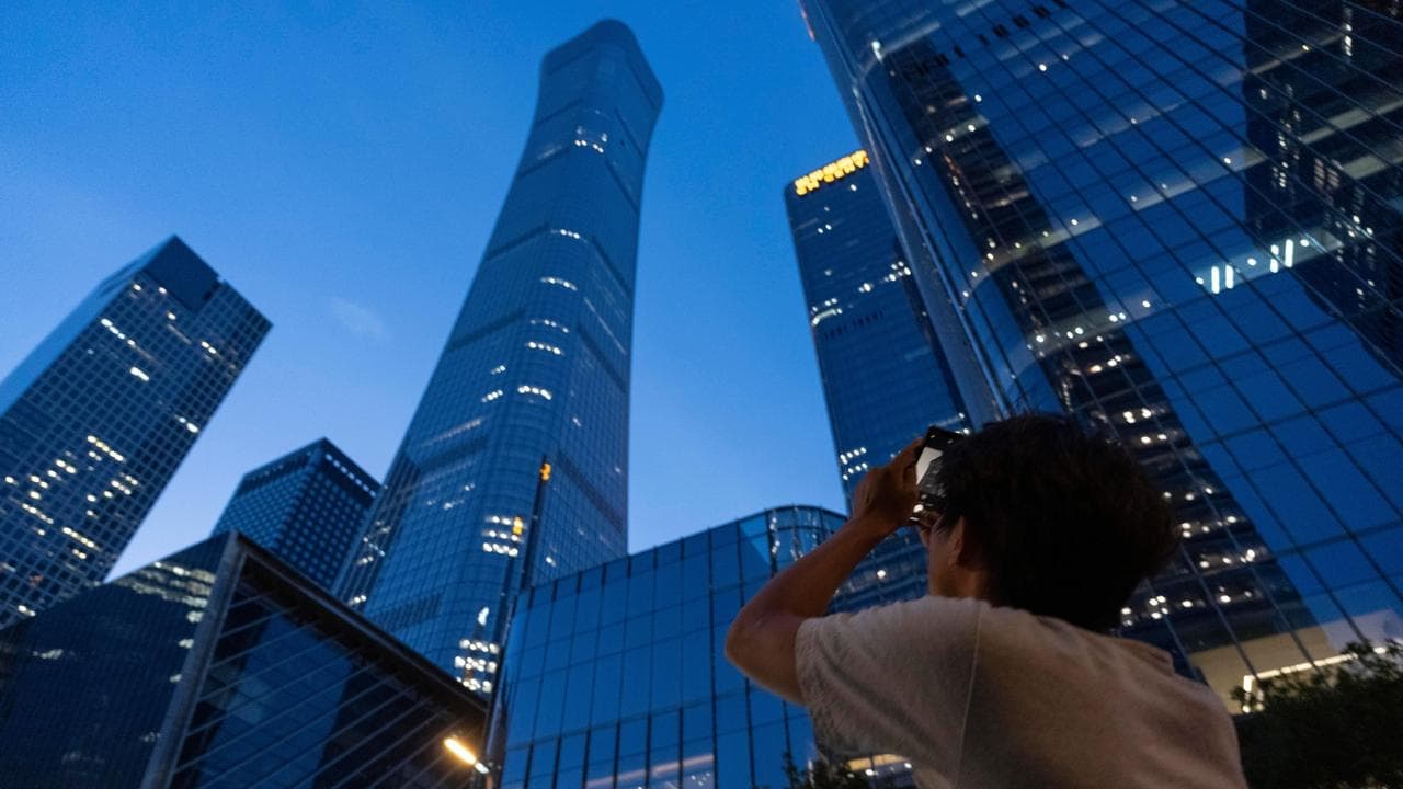 Small plane hits Beijing's tallest building: witnesses