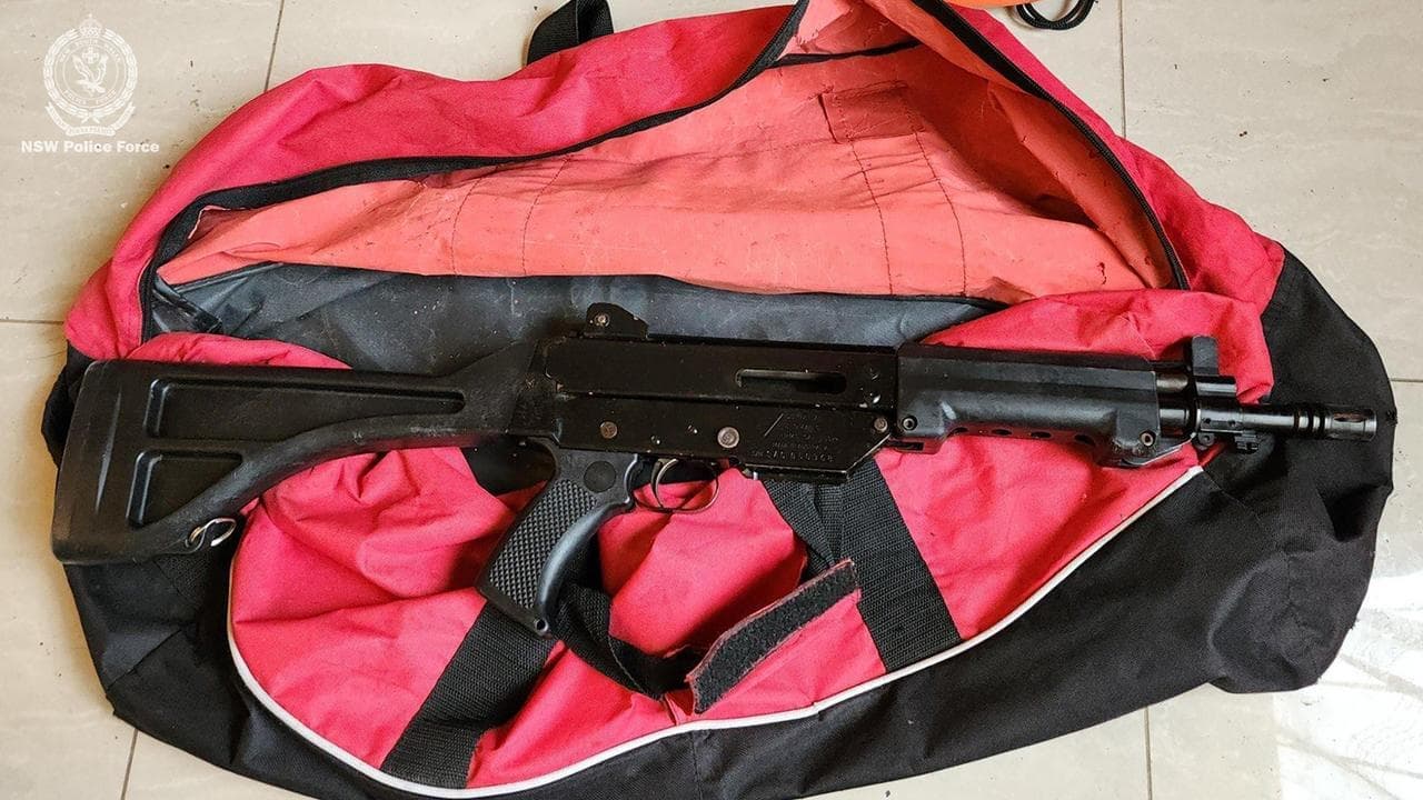 Military-style weapons seized in safe house raid