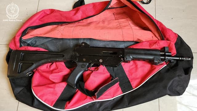 Military-style weapons seized in safe house raid