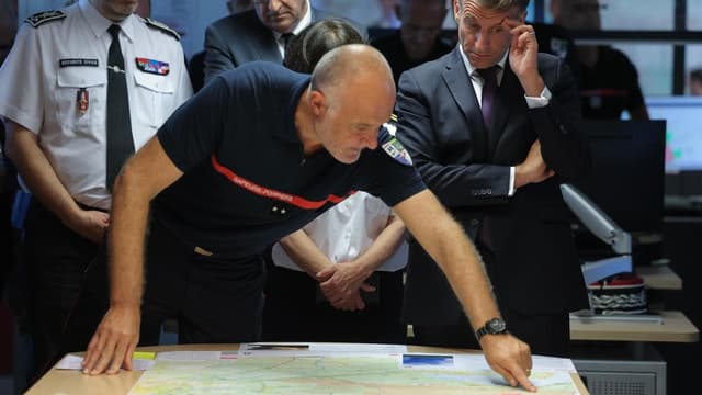 Macron visits fire zone, 'to win this battle together'