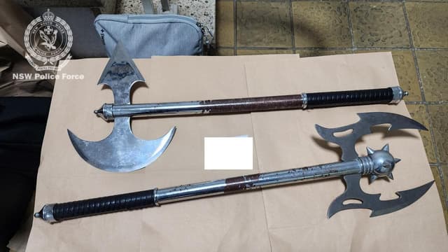 Suburban raids net crossbows, guns and battle axes